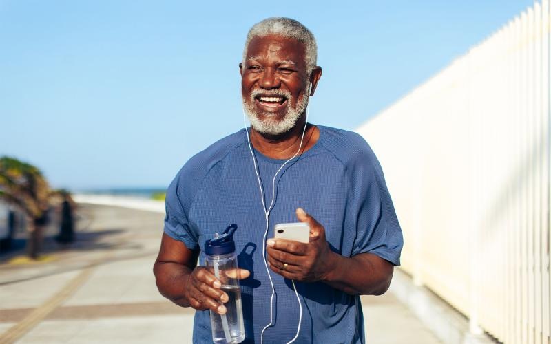 a man holding a water bottle while outdoors