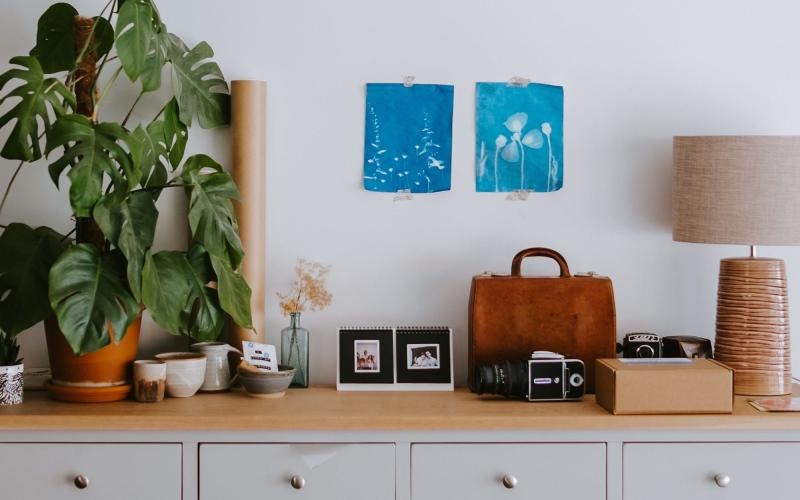 large dresser with a variety of decor on it