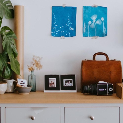 large dresser with a variety of decor on it