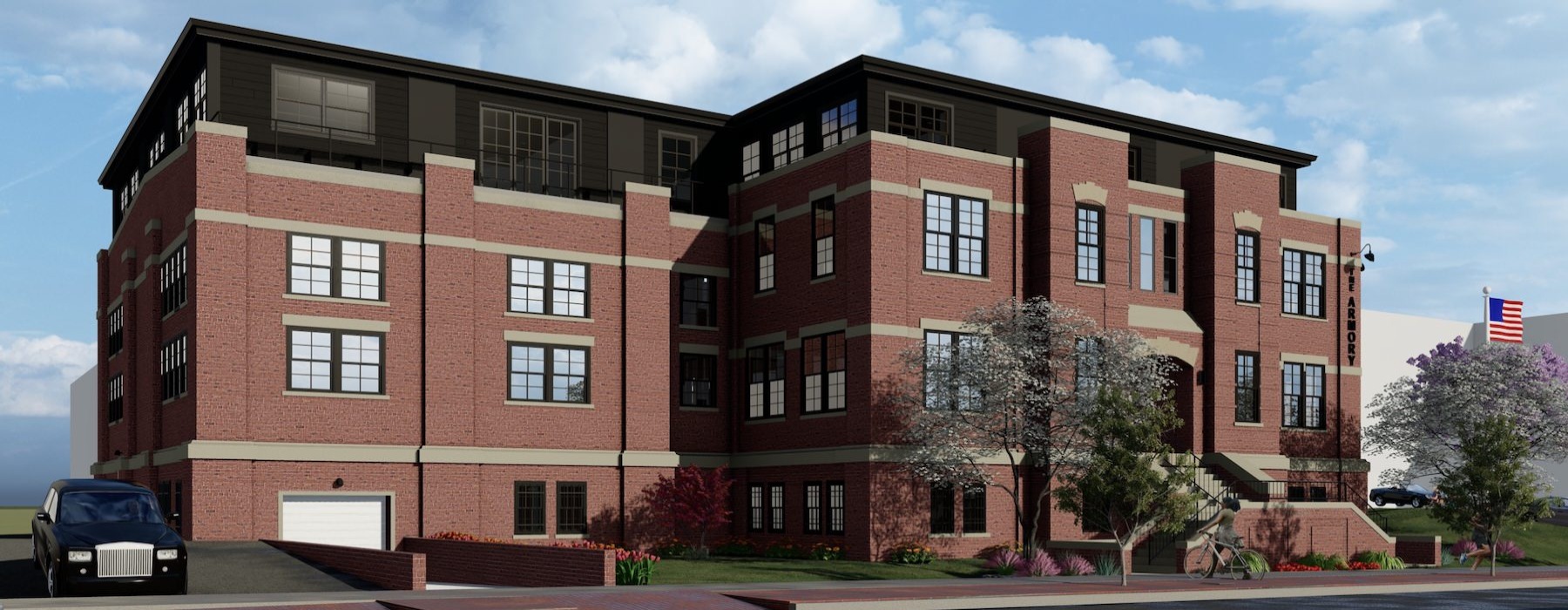 a large brick building with a flag