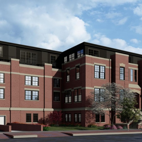 a large brick building with a flag